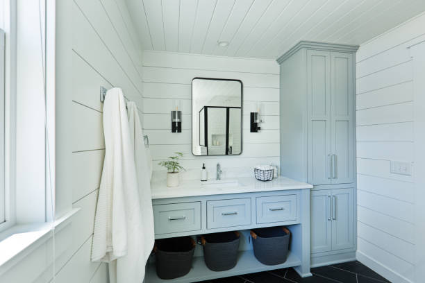 bathroom cabinets in San Antonio for all bathroom sizesBathroom Vanities in San Antonio- A contemporary modern bathroom design for a country home cabin. featuring a classic freestanding vanity and linen storage cabinet.
